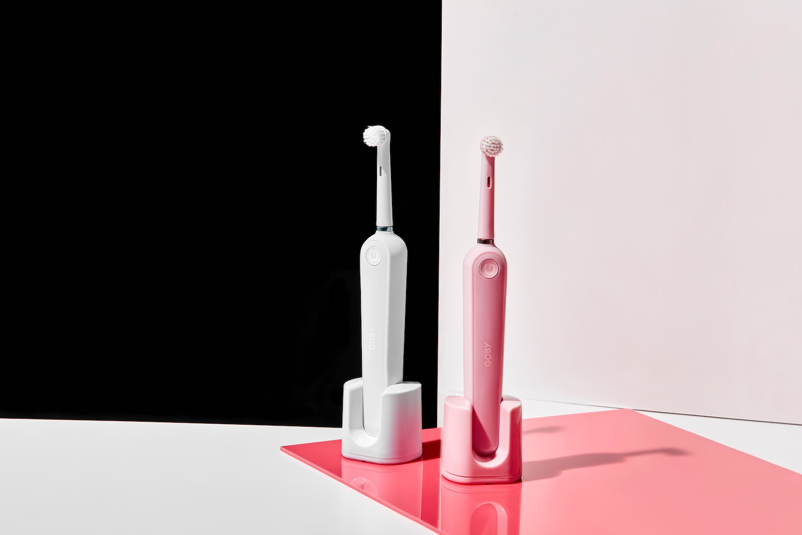 two electronic toothbrushes